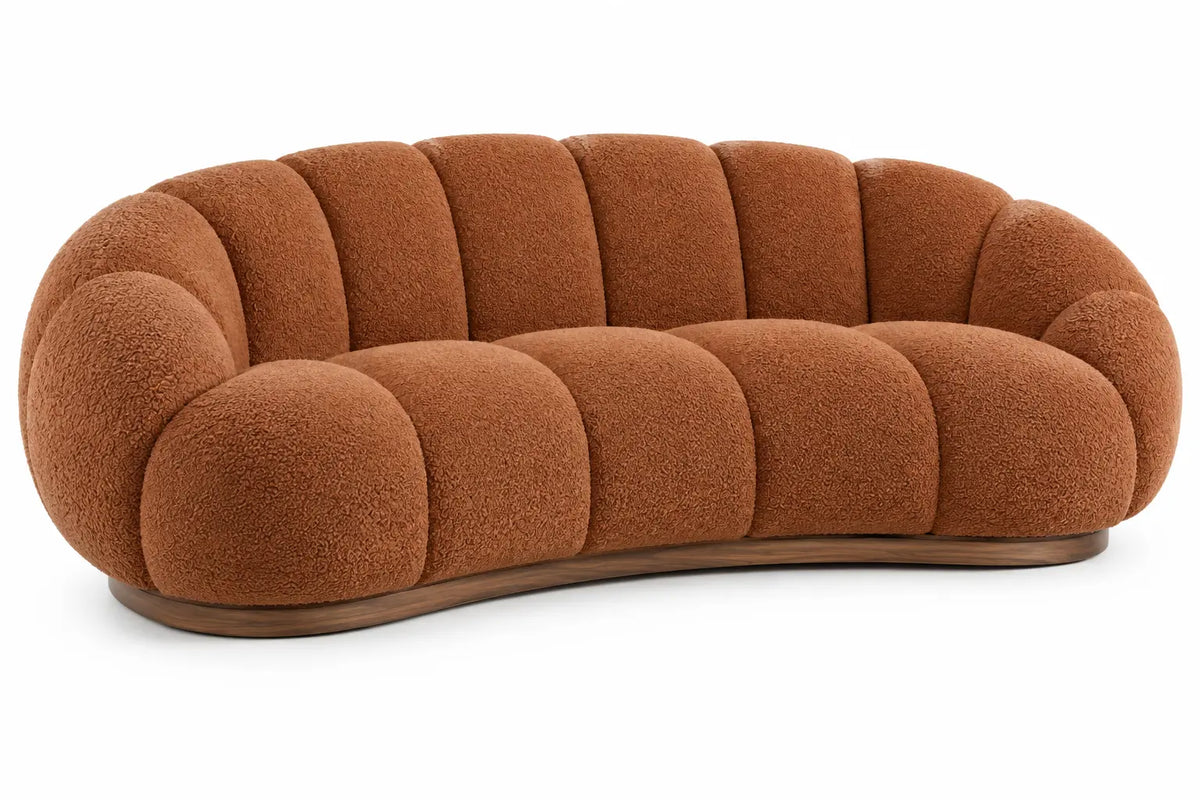Sofá curvo tapizado con acolchado acanalado, terracota